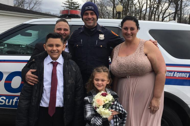 Joseph DeMichele and Feliece Terwilliger with police officer Cody Matthews