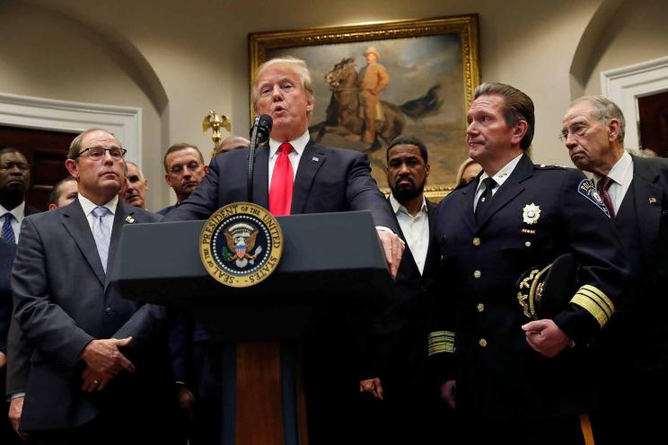 President Trump speaking at the podium.