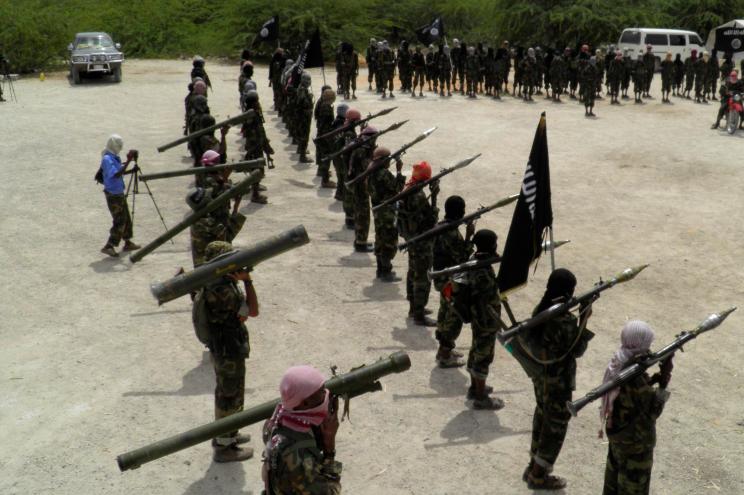 Al-Shabaab fighters display weapons as they conduct military exercises in northern Mogadishu, Somalia.