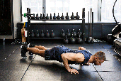 Mike Bell, trainer at Performix House, demonstrates proper push-up form.