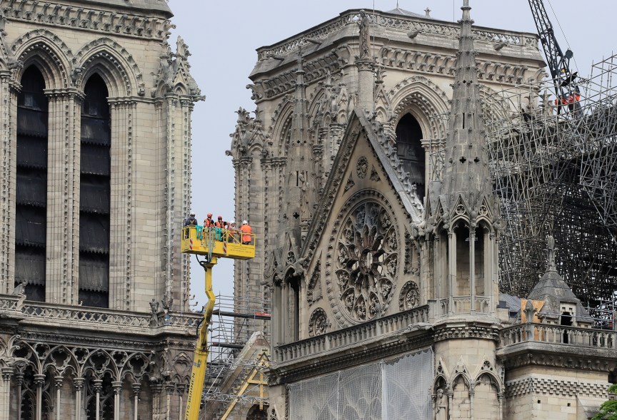 Men work to strengthen a part of Notre Dame cathedral.