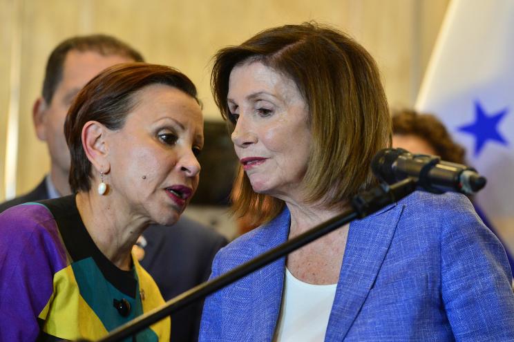 Congresswoman Nydia Velazquez speaks with Nancy Pelosi.