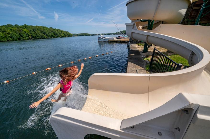 Lorelai Luoma flies off the massive water slide at her grandmother’s $2 million lake house.