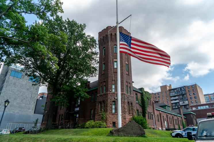 American flag at half staff outside SRG 4 in Queens