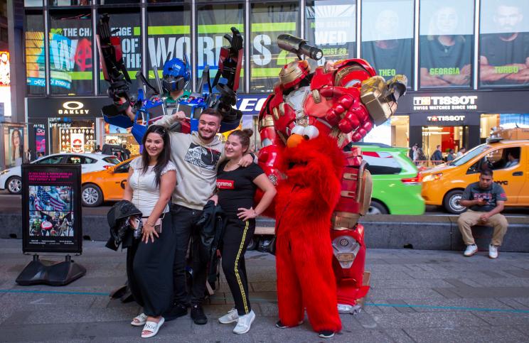 People dressed as Elmo and other fictional characters who work for tips in Times Square, Manhattan.