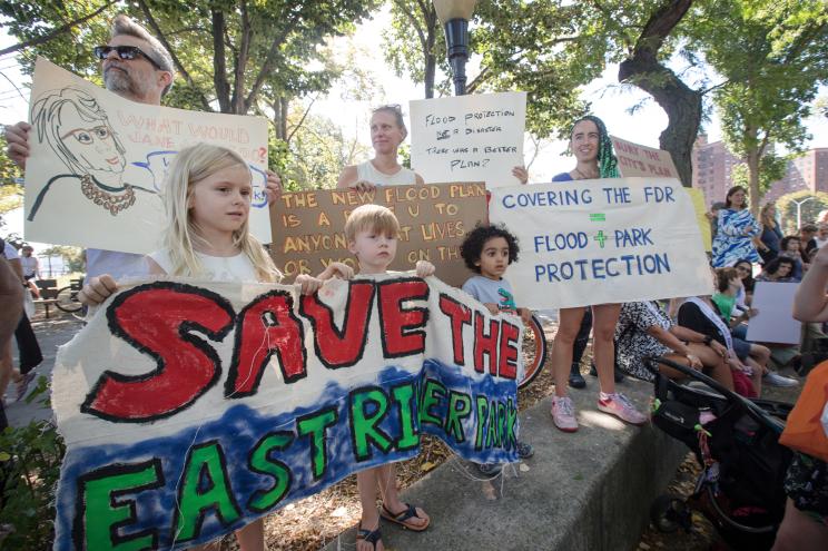 People gather to protest over the plan to use East River Park land for a flood barrier.