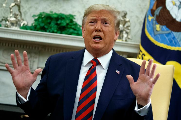 President Donald Trump speaks during a meeting in the Oval Office.