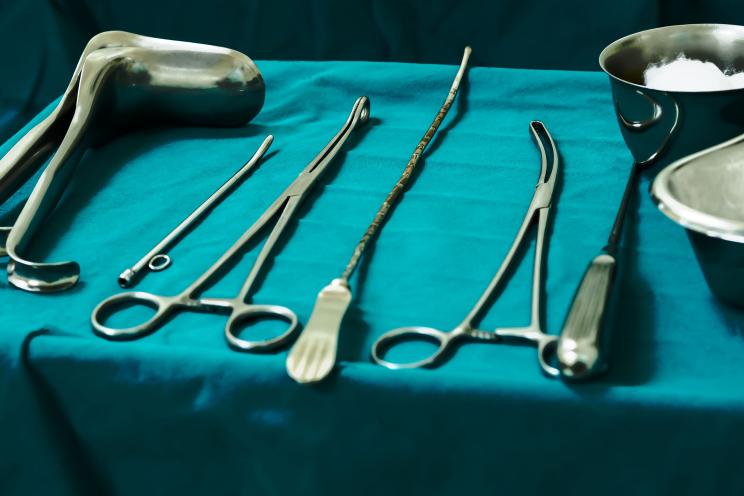 Sterile curettage tools, forceps, retractor in operation room at medical hospital for treatment of abortion, abnormal female menstruation period or bleeding, miss carriage.