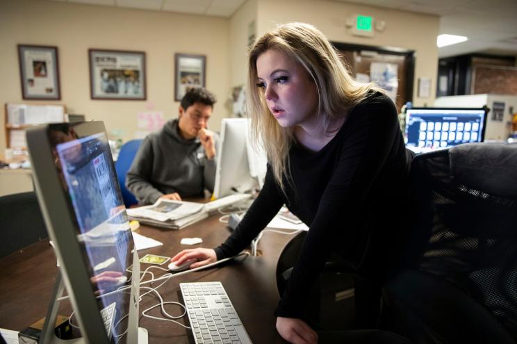 Editor-in-Chief Maddy Arrowood, a senior journalism and American history major, checks pages of The Daily Tar Heel, the independent student newspaper of the University of North Carolina.