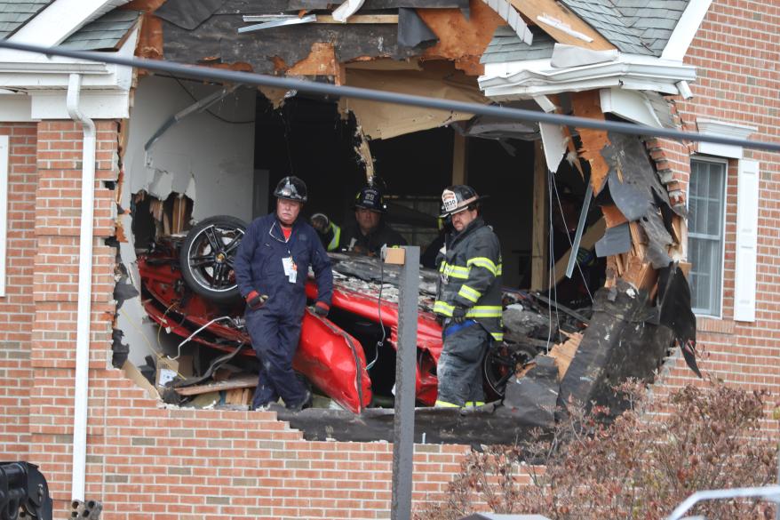 The car being removed from the building.