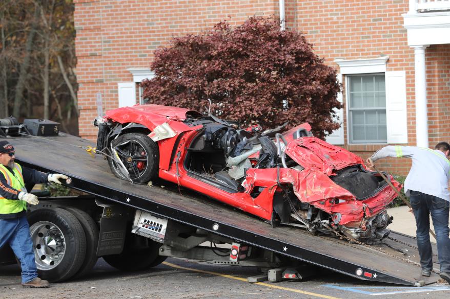 The car being removed from the building.