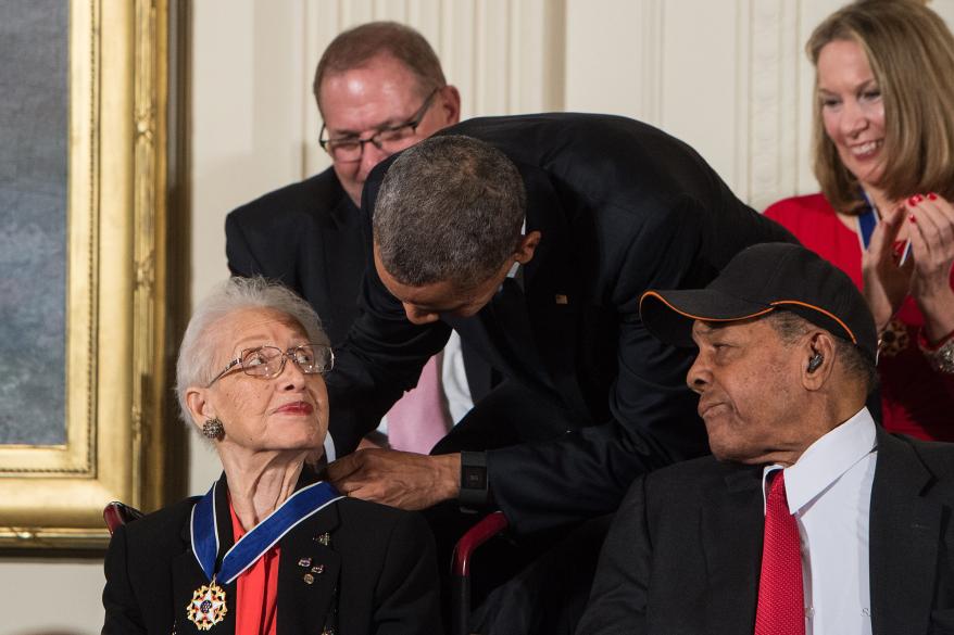 Barack Obama presents the Presidential Medal of Freedom to NASA mathematician and physicist Katherine Johnson at the White House in Washington, DC, on November 24, 2015