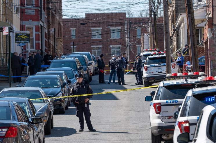 Police officers at the scene of a suspected murder-suicide in Astoria.