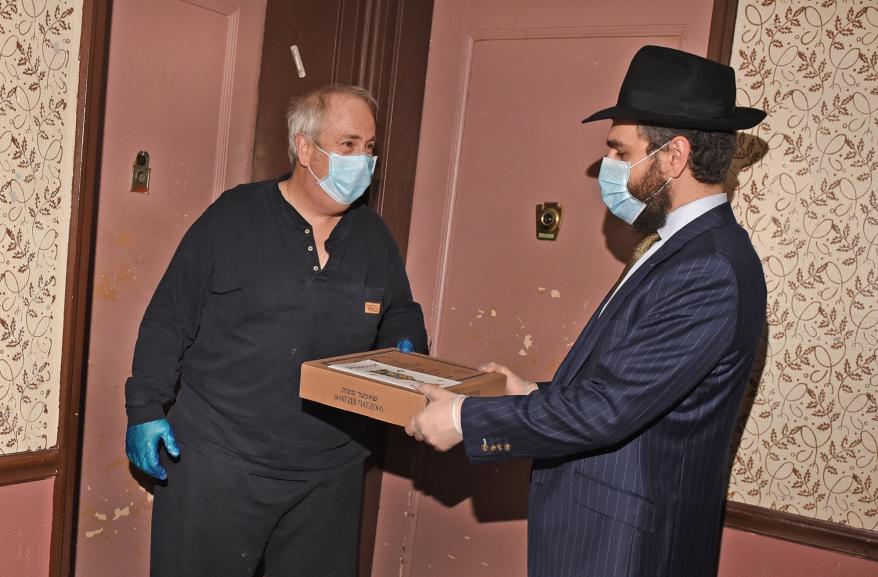 Rabbi Moshe Hecht has been making home deliveries to citizens of the Jewish community for Passover