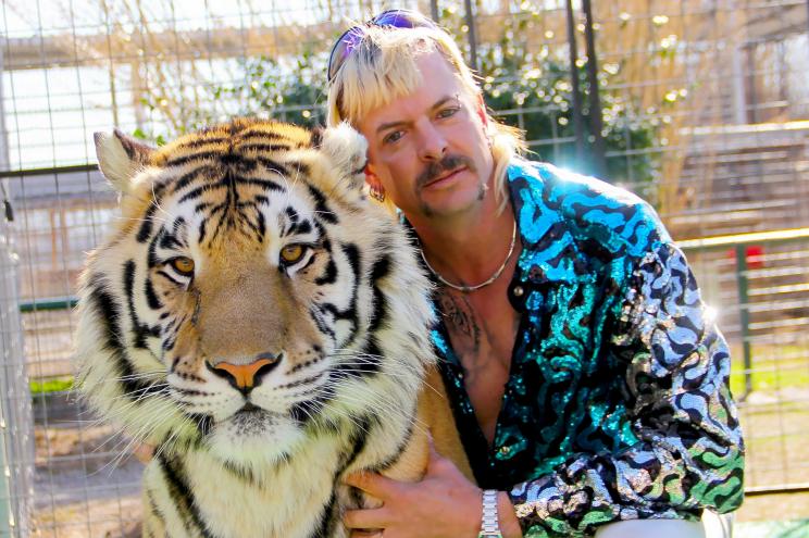 Joe Exotic cuddles with a big cat in "Tiger King."