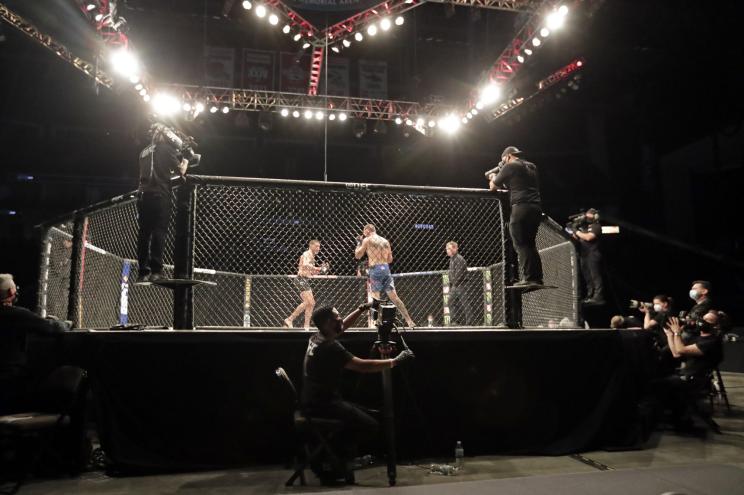 Anthony Pettis, center left, and Donald Cerrone fight during UFC 249.