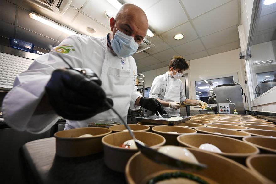 French two Michelin stars chef Olivier Nasti prepares meals with his brigade in the kitchen of his restaurant "Le Chambard" in Kaysersberg, eastern France, on April 23, 2020 as the country is under a strict lockdown to stop the spread of the COVID-19