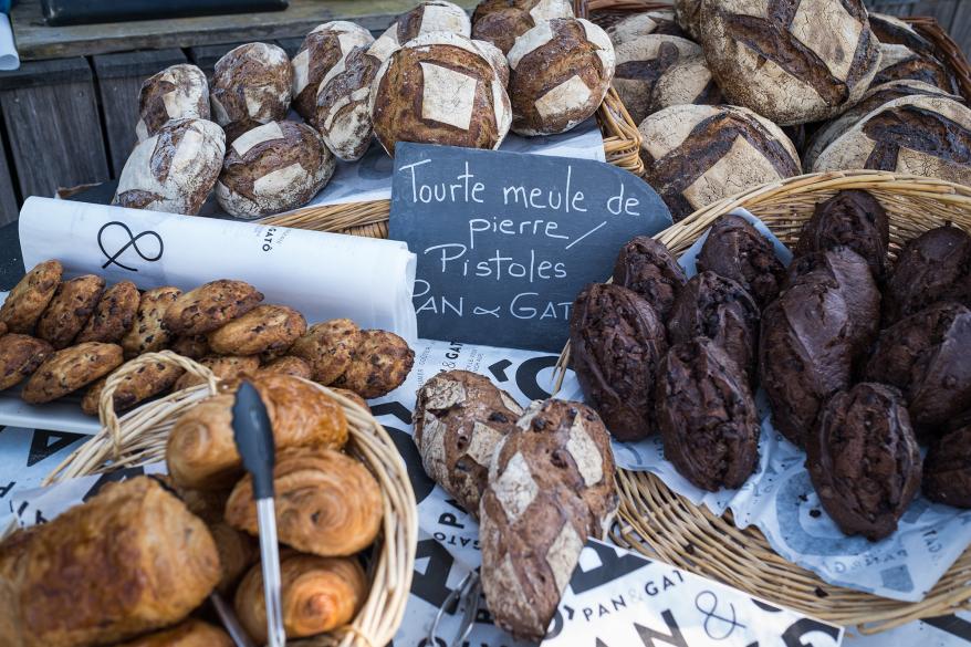 Croissants, cookies, bread and Pistoles (chocolate bread) are displayed at the Pan & Gato bakery stand at 'Le Clos des Sens' restaurant on April 25, 2020 in Annecy-le-Vieux, France.