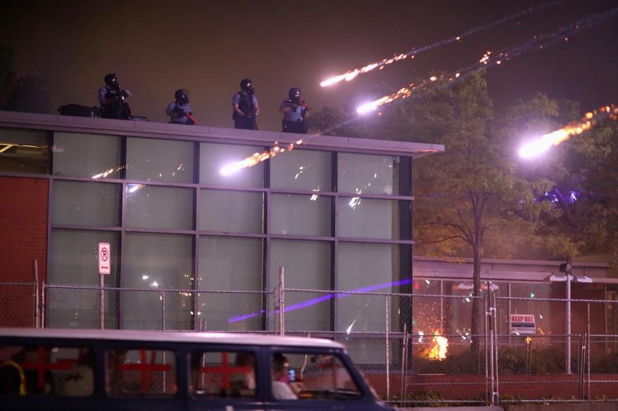 Police officers take up positions in midst of the protests.