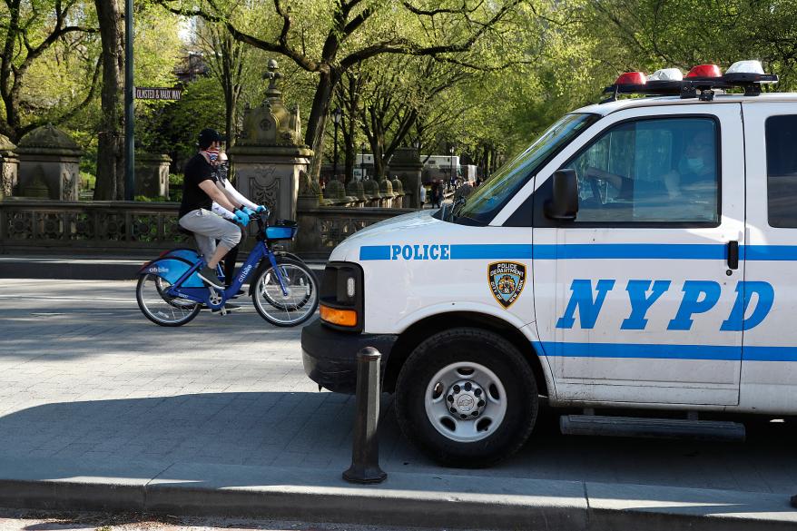 NYPD patrolling Central park to assure people keep to social distancing rules.