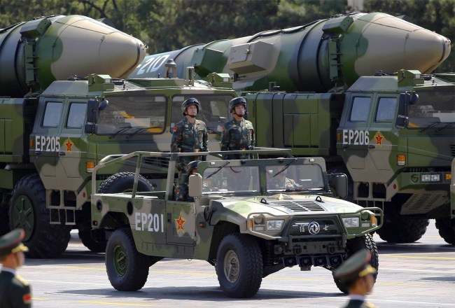 Military vehicles carrying DF-21D ballistic missiles roll to Tiananmen Square during a military parade