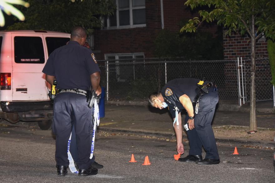 Police at the scene of a shooting in Brooklyn today.