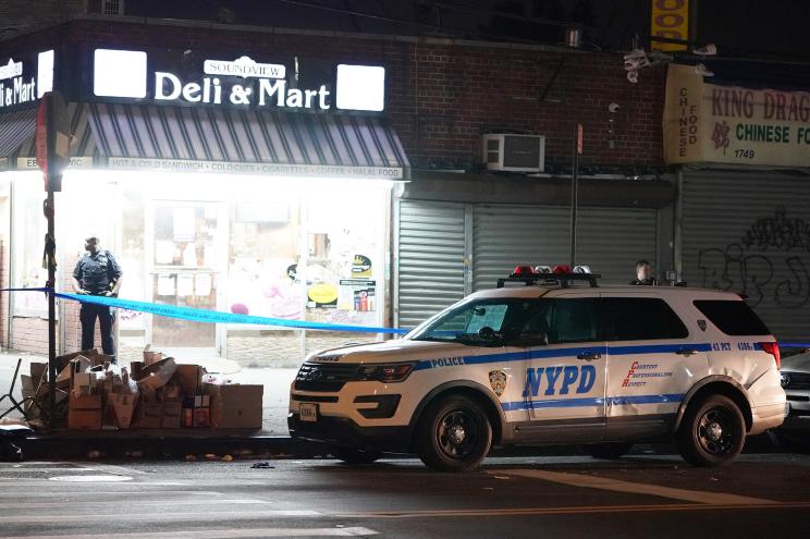 Police at the scene where a person was shot on Randall Avenue at Rosedale Avenue in the Bronx last night.