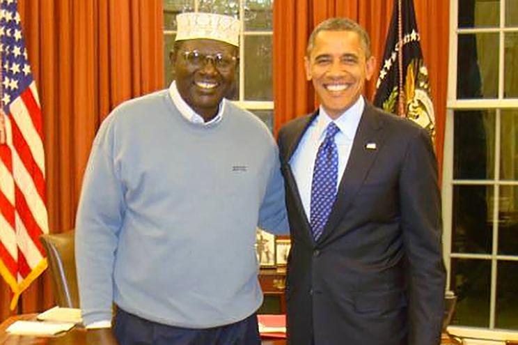 Malik Obama and Barack Obama in the Oval Office in 2012.