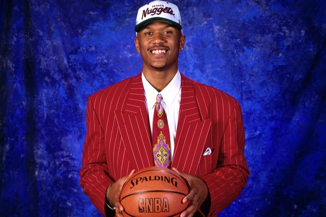 Jalen Rose poses after being drafted in 1994.