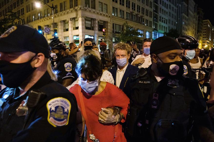 Sen. Rand Pau is escorted by police after attending President Trump's RNC acceptance speech at the White House last month.