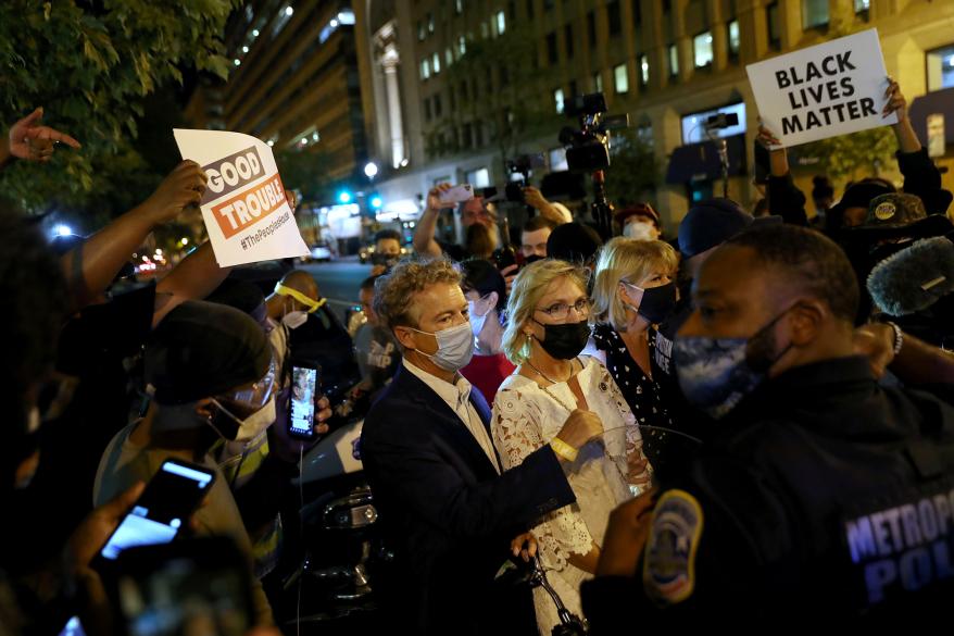 Sen. Rand Pau is escorted by police after attending President Trump's RNC acceptance speech at the White House last month.