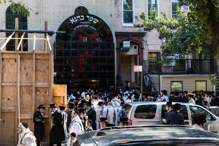 People gathered outside for the Yom Kippur prayer service held at the Congregation Yetev Lev D'Satmar synagogue at 152 Rodney Street in Williamsburg, Brooklyn.