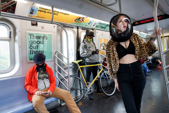 Hannah Frishberg wears a coronavirus protection helmet