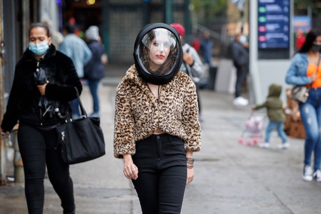 Hannah Frishberg wears a coronavirus protection helmet