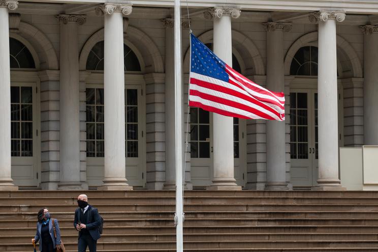 The American flag appears limp at half-staff outside of City Hall — thanks to an order from Gov. Cuomo to honor the COVID-19 dead. But now it seems like a line of defeat.