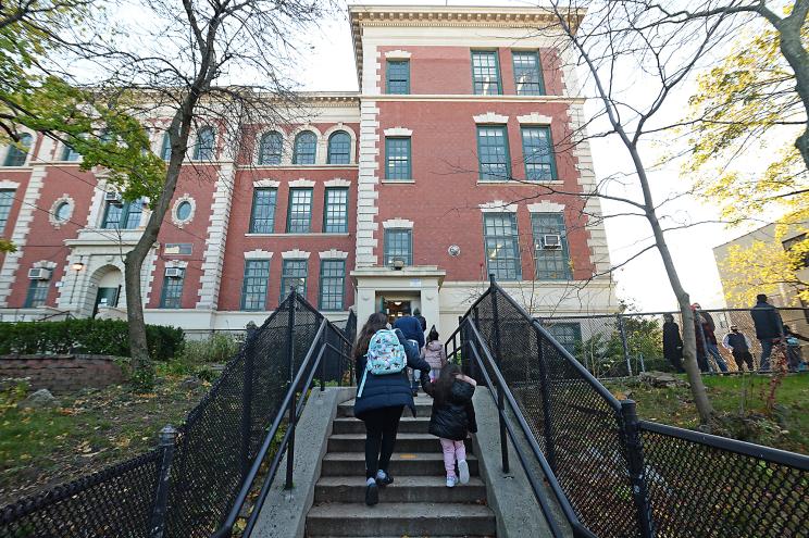 Parents drop off their children at PS 84, in 22-45 41 St., Queens.