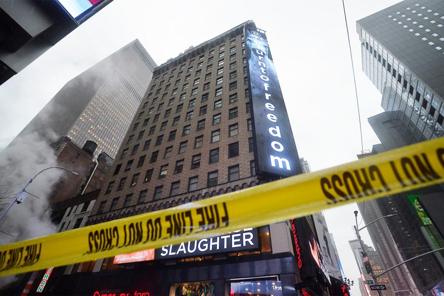 NYPD and FDNY respond when a piece of falling debris from the building at the corner of 49th and 7th Ave.