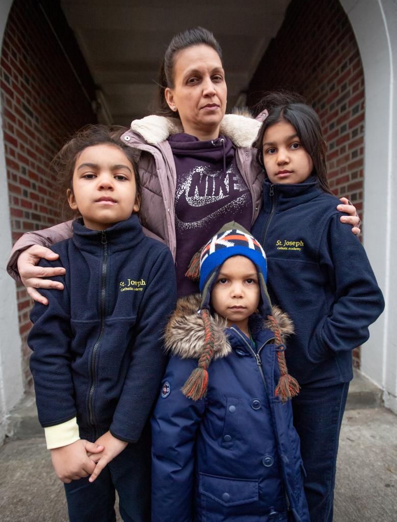 Catherine Sanchez poses with her children (from left) Mia age 8, Jaden age 3, and Gianna age 8 in Queens.