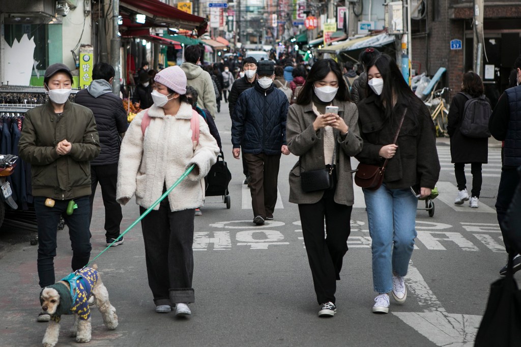 People wear masks outside in Seoul, South Korea