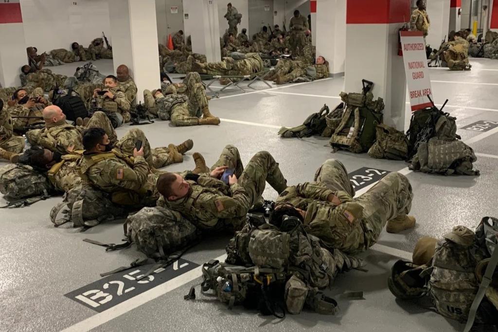 Thousands of National Guardsmen were “banished” to a cramped parking garage after being forced to leave parts of the US Capitol grounds.