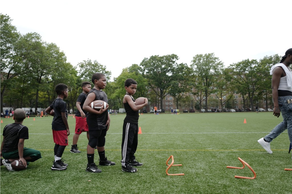 “We teach the kids fundamentals of football. We teach them how to be young men,” says Coach Gawuala.