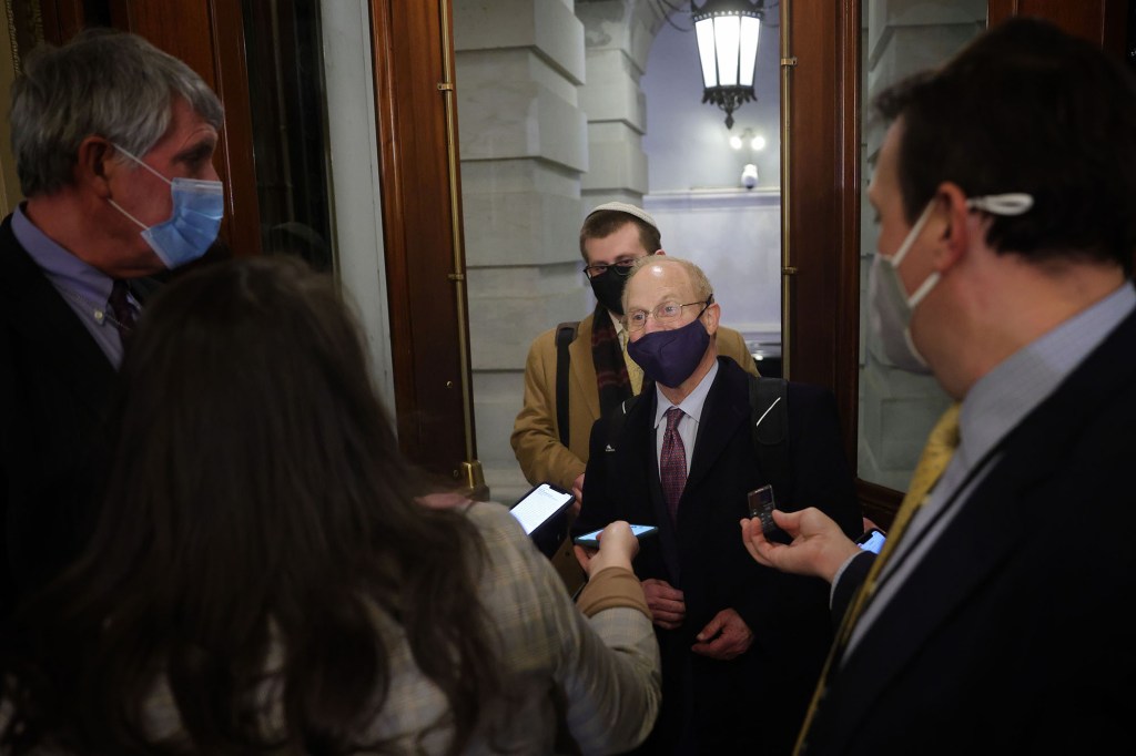 David Schoen talks to the media while leaving the Capitol after the first day of former President Donald Trump's second impeachment trial.