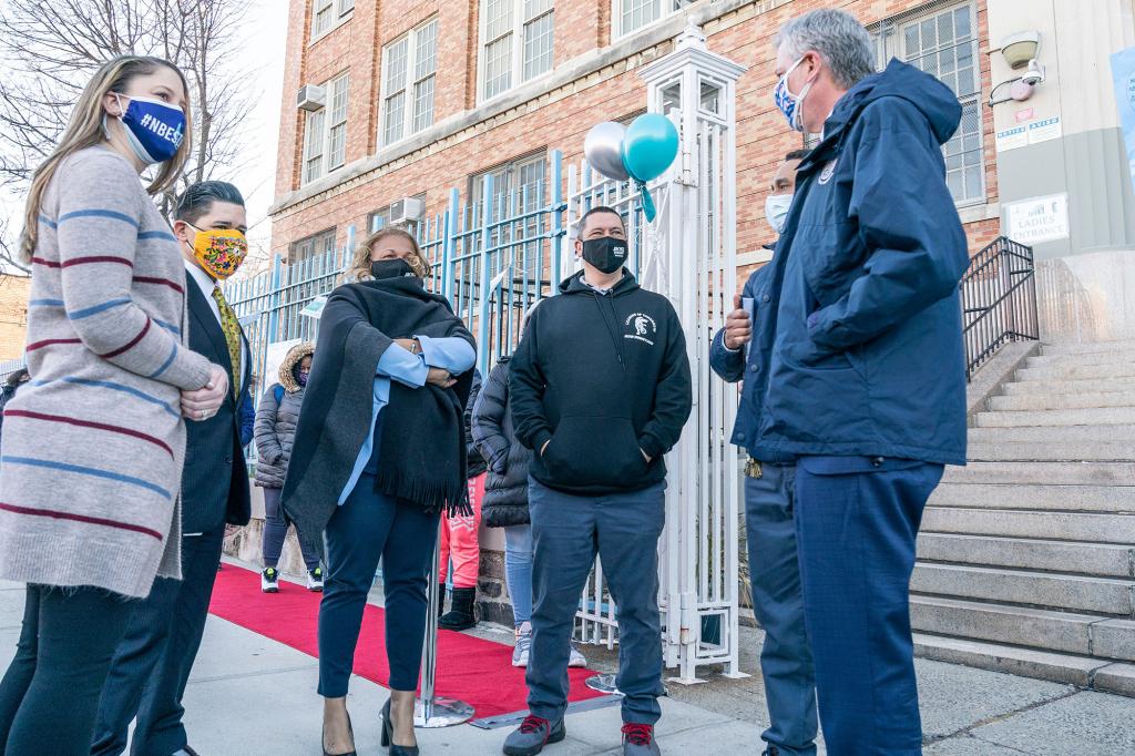 Meisha Ross-Porter, center, speaks with Mayor Bill de Blasio and Chancellor Richard Carranza during a visit to Leaders of Tomorrow Richard R. Green Middle School in the Bronx.