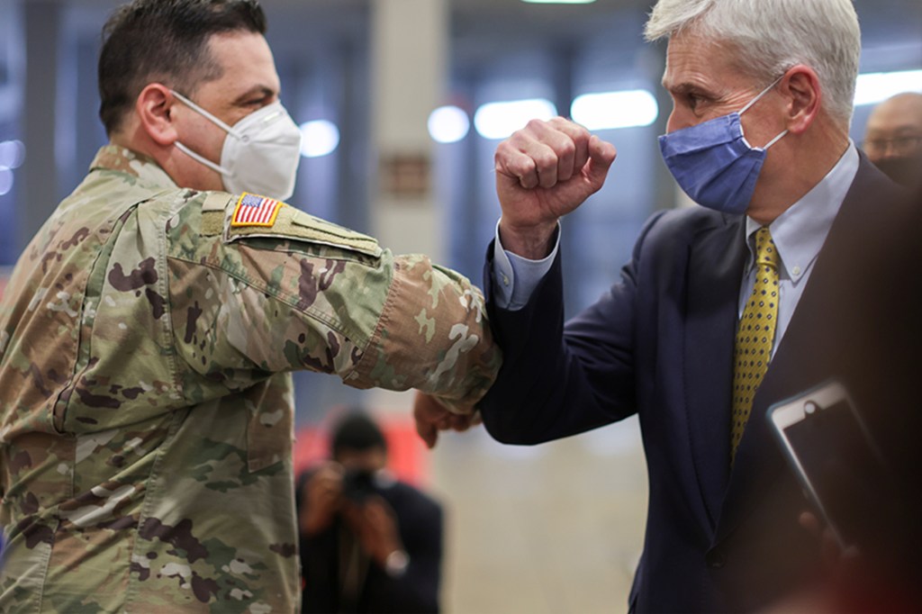 National Guardsman Vincent Scalise and Senator Bill Cassidy who helped Scalise achieve a photo with all 100 senators.