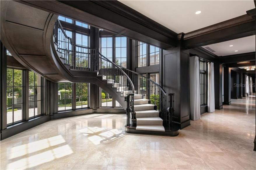 A spiral staircase located in the grand foyer.