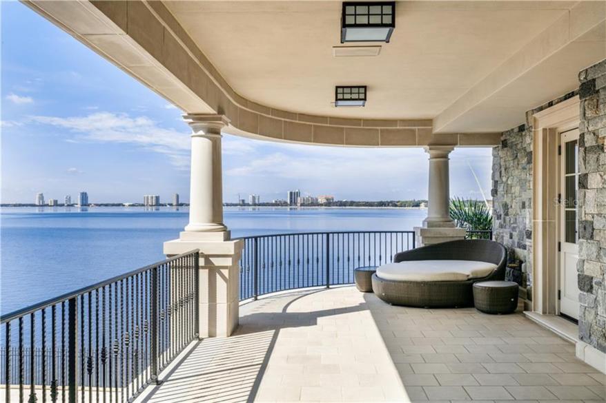 An expansive terrace on the master-suite floor that opens out to the bay.