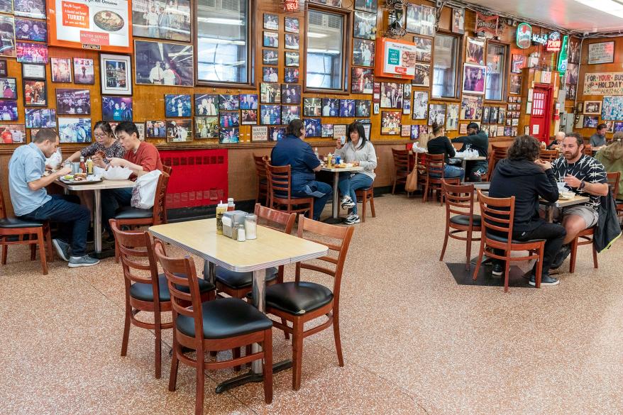 Customers eat socially distanced inside Katz's Deli in the Lower East Side.