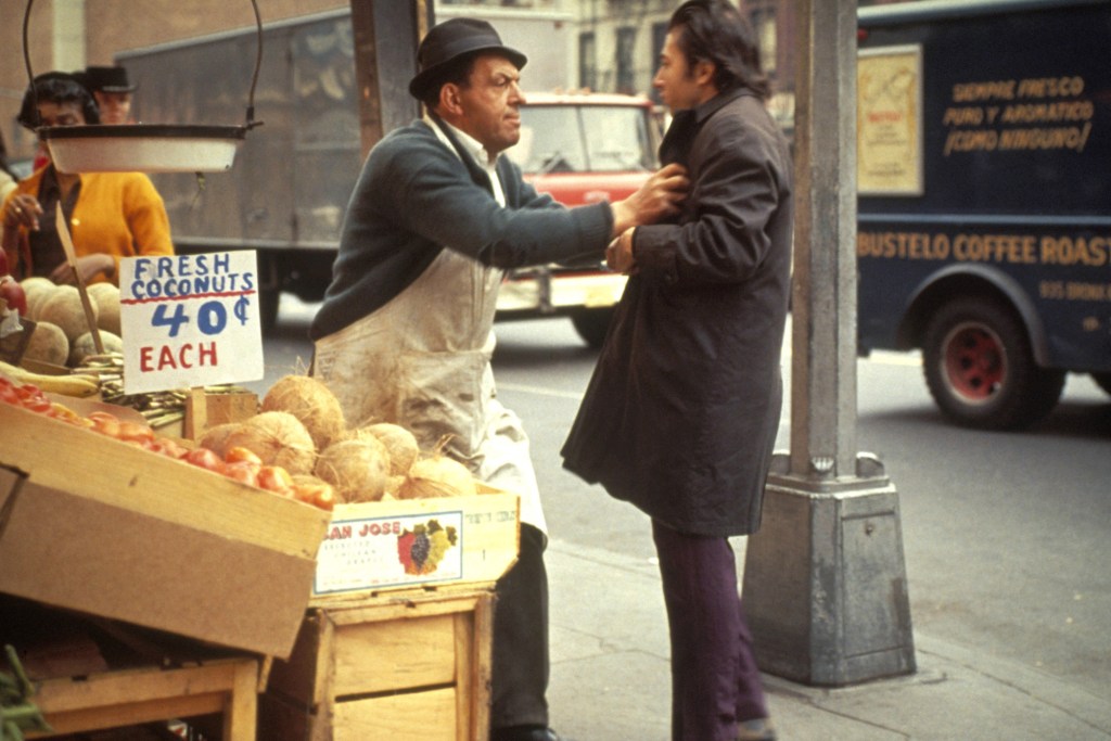 Hoffman (right) films on the Lower East Side.