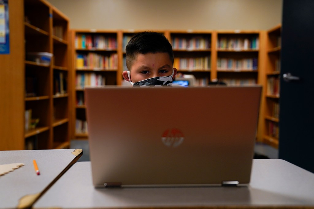 A Los Angeles Unified School District student attends an online class.