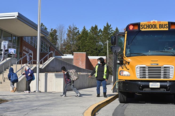 A school bus arrives at Ashlawn elementary school on March 4, 2021 in Arlington, VA.